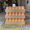 3 cases of Preston's Ginger Beer sitting on a loading dock.