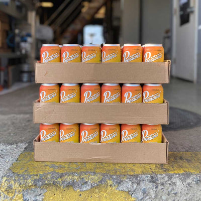 3 cases of Preston's Ginger Beer sitting on a loading dock.